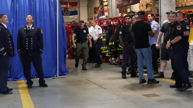 New York City, United States - 11 September 2023: Firefighters celebrate Patriot Day. 911 memorial remembrance event, FDNY commemorate anniversary. Fire Department Station, Manhattan 10 Ten Firehouse.