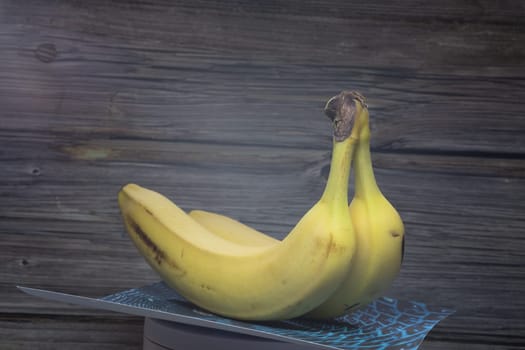 yellow sweet bananas on table move arround