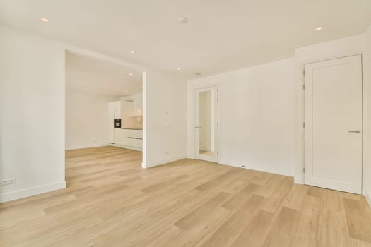 Bright and airy open space featuring wooden flooring and minimalistic design elements, ideal for contemporary living or office use.