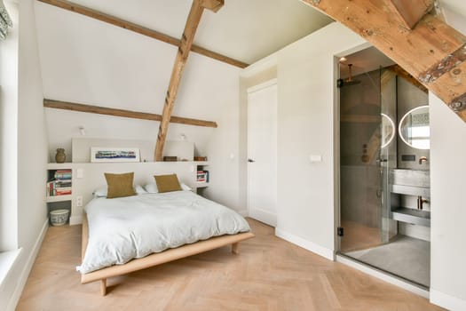 A serene modern bedroom featuring wooden beams, a minimalist design, and a cozy bed, showcasing a blend of comfort and style in a soothing color palette.