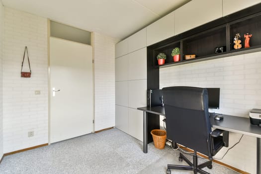 A sleek and contemporary home office featuring clean lines, neutral colors, and smart organization. The design promotes a productive workspace ambiance.
