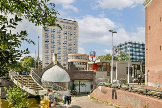 A vibrant city scene showcasing contemporary buildings, pedestrian areas, and lush greenery beside water, merging nature and urban life seamlessly.