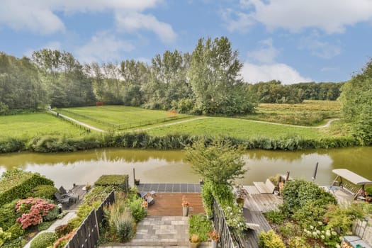 A tranquil scene featuring a winding river surrounded by vibrant greenery, showcasing a peaceful outdoor environment ideal for relaxation and nature appreciation.