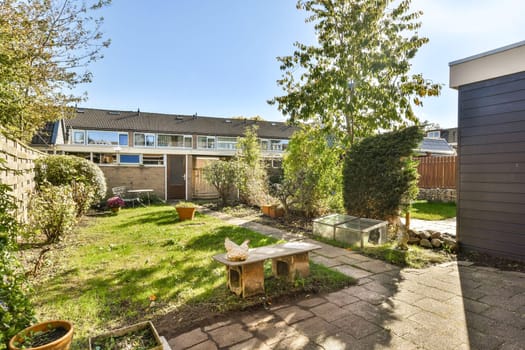 A serene garden showcasing vibrant plants, well-maintained pathways, and a cozy seating area, perfect for relaxation and outdoor enjoyment.
