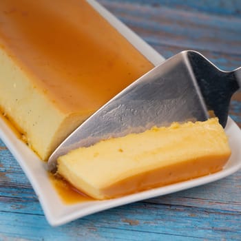 Cream caramel pudding with caramel sauce on a plate, Flan, High quality photo