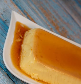 Cream caramel pudding with caramel sauce on a plate, Flan, High quality photo