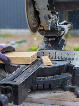 Cutting wood boards man in hands. Selective focus. People.