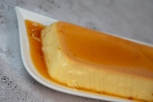 Cream caramel pudding with caramel sauce on a plate, Flan, High quality photo