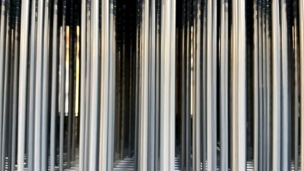 A stunning visual of metallic columns reflecting light, creating an exceptional abstract aesthetic that captivates