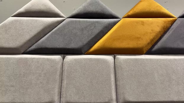 A collection of fabric swatches featuring geometric shapes and various colors for design inspiration.