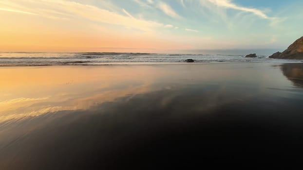 A breathtaking beach sunset that reflects beautifully on the calm waters, creating a truly peaceful atmosphere