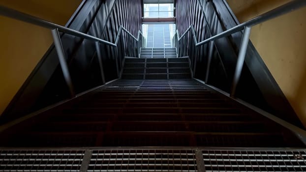 A stunning view of a modern staircase with sleek metal railings and geometric lines throughout the design