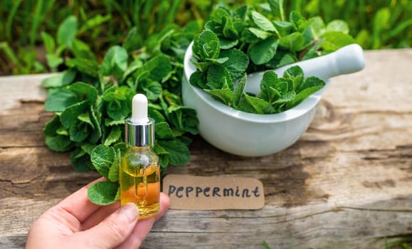 Peppermint extract essential oil and supplements. Selective focus. nature.