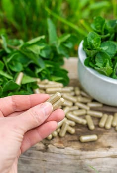 Peppermint extract essential oil and supplements. Selective focus. nature.