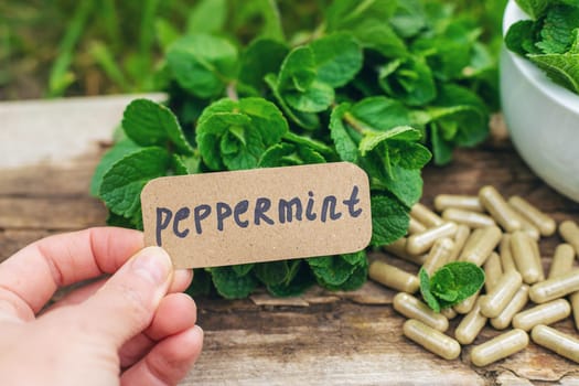 Peppermint extract essential oil and supplements. Selective focus. nature.