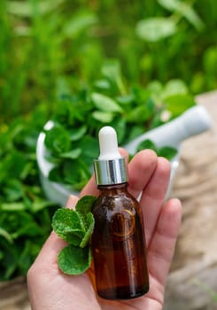 Peppermint extract essential oil and supplements. Selective focus. nature.