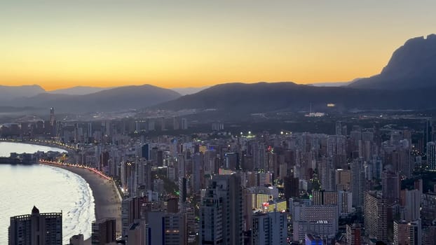 A breathtaking skyline view that perfectly showcases the stunning beauty of a coastal city during dawn