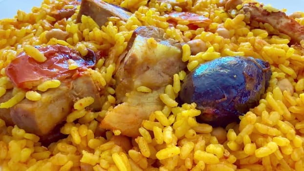 This vibrant and appetizing dish features tender and juicy chicken paired with saffron rice and fresh, ripe tomatoes