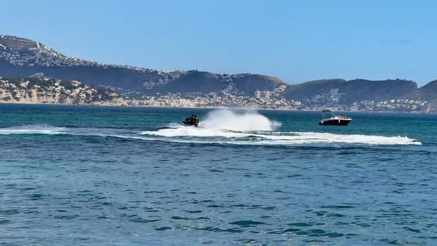 Experience thrilling moments of jet skiing amidst breathtaking and stunning coastal scenery in the sunshine