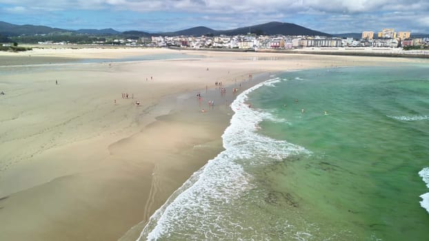 This stunning beach scene with clear turquoise water and golden sand is perfect for ultimate summer relaxation