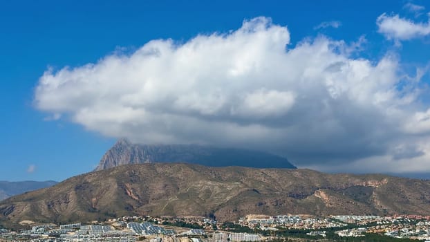 A breathtaking view of stunning mountains with dramatic clouds above, beautifully capturing natures beauty