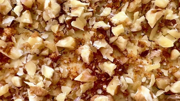 A closeup view of a delightful walnuttopped baked dessert that beautifully showcases both texture and flavor