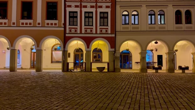 A breathtakingly picturesque night view showcases charming historic buildings adorned with beautiful archways
