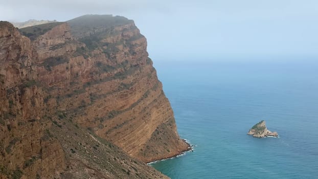 Experience the breathtaking cliffs meeting the serene ocean waves, a perfect destination for all nature lovers