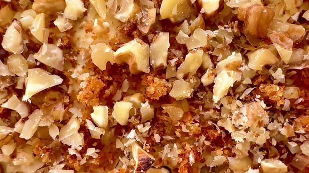 Closeup of finely chopped nuts, ideal for various recipes, baking projects, and culinary presentations