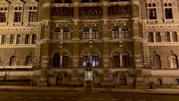 A beautifully illuminated historic building elegantly showcasing its intricate architectural details at night