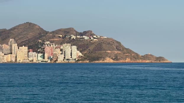 A breathtaking view showcasing a vibrant seaside city adorned with modern architecture and an exquisite shoreline