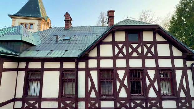 The halftimbered architecture stands under the blue sky, showcasing intricate designs that capture the eye