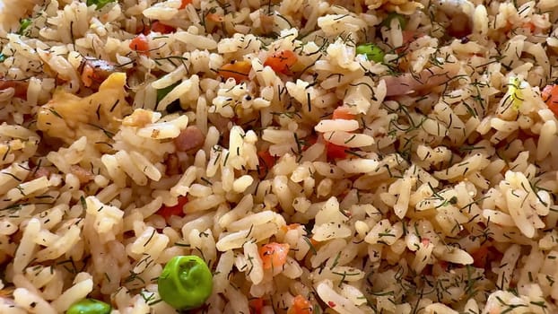 A vibrant vegetable rice dish garnished with fresh herbs and assorted veggies, perfect for any meal