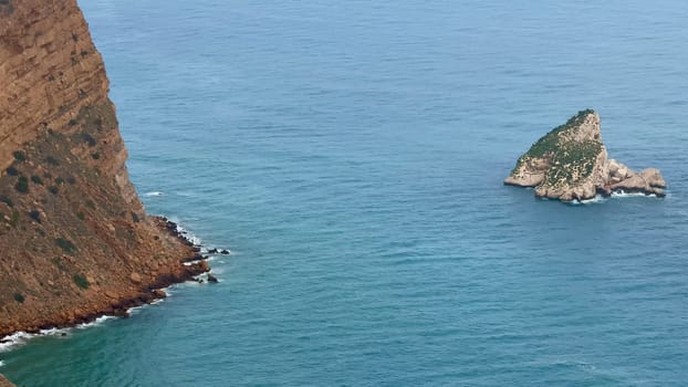 The coastal cliffs blend with deep blue waters, showcasing natures incredible beauty for all to enjoy