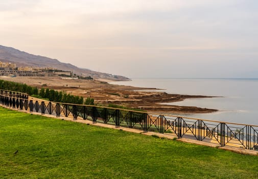 View along the coast of Dead Sea in Jordan with construction of new hotels in distance