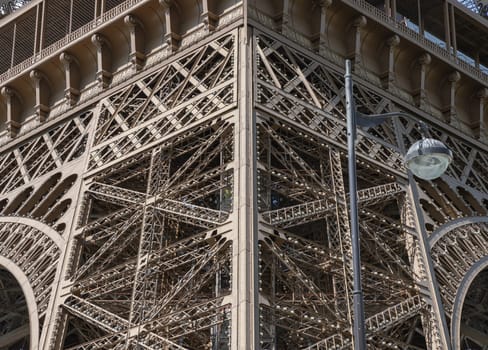 France, Paris - May 03, 2025 - Iconic Landmark Steel Structure of The Ultimate Eiffel Tower architecture details in Paris. Close-up of the framework of the Eiffel Tower, use it as your Wallpaper, Poster and Space for text, Selective focus.