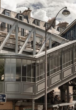 France, Paris - May 03, 2025 - Exterior view of the Bir-Hakeim Metro Station overhead track with metal bridges and raised stations, Boulevard de Grenelle, 15th arrondissement, Paris. use it as your Wallpaper, Poster and Space for text, Selective focus.