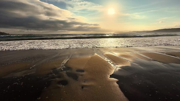 A serene and tranquil beach scene showcasing stunning sunset reflections beautifully shimmering on sandy shores