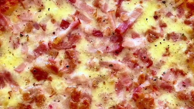 Experience the mouthwatering closeup of a deliciously tasty bacon and cheese pizza, so fresh from the oven
