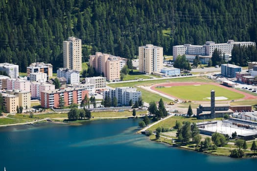 Switzerland, St.Moritz - June 6, 2023: aerial view to the city St. Morirz and lake on sunny summer day.