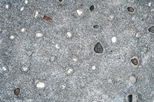 grey asphalt textured background with sidewalk stones