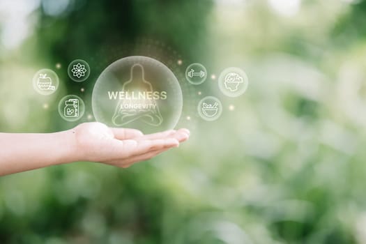 Digital wellness icons floating above an open palm. Balance, nutrition, fitness, and self-care concept.