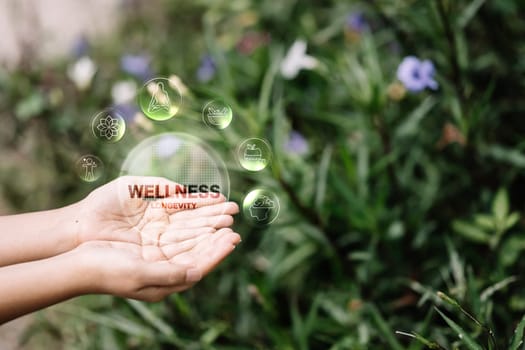 Wellness symbols floating above open palms. Self care, mindfulness, and healthy lifestyle concept.