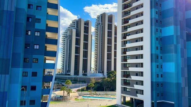 A stunning view of a contemporary residential area featuring elegant buildings and tranquil surroundings.