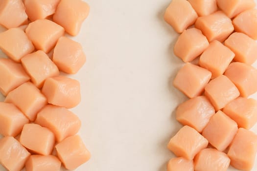 AI generated top view of fresh raw chicken meat cut into pieces from various parts piled neatly with vibrant color on clean white background