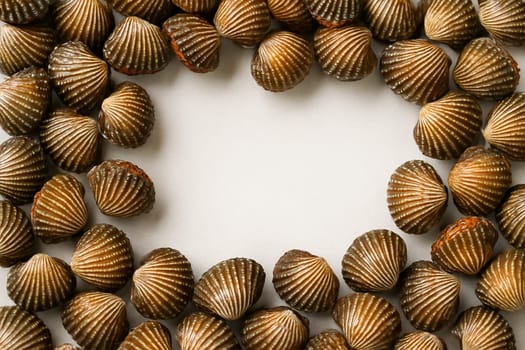 AI generated top view of fresh whole blood cockles with glossy shells and vibrant color arranged neatly showcasing authentic seafood against clean white background