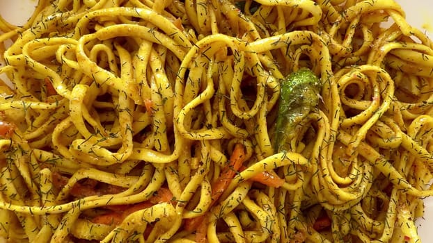 Indulge in a vibrant plate of spicy noodles, a dish that is truly perfect for all lovers of Asian cuisine