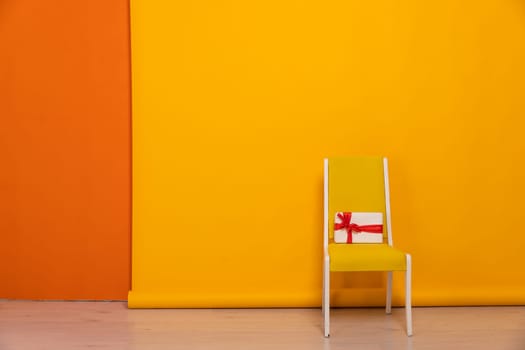 One Yellow Vintage Chair With Gift In The Interior Of A Flat Room