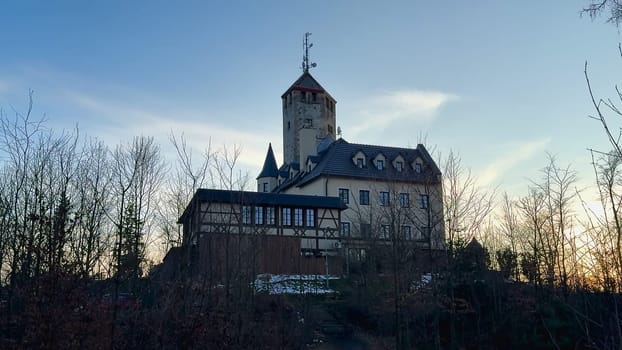 A stunning and enchanting castle beautifully capturing the breathtaking beauty of twilight amid lush greenery