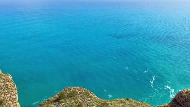 Breathtaking views of majestic cliffs dramatically meeting the clear blue ocean, perfect for all nature lovers